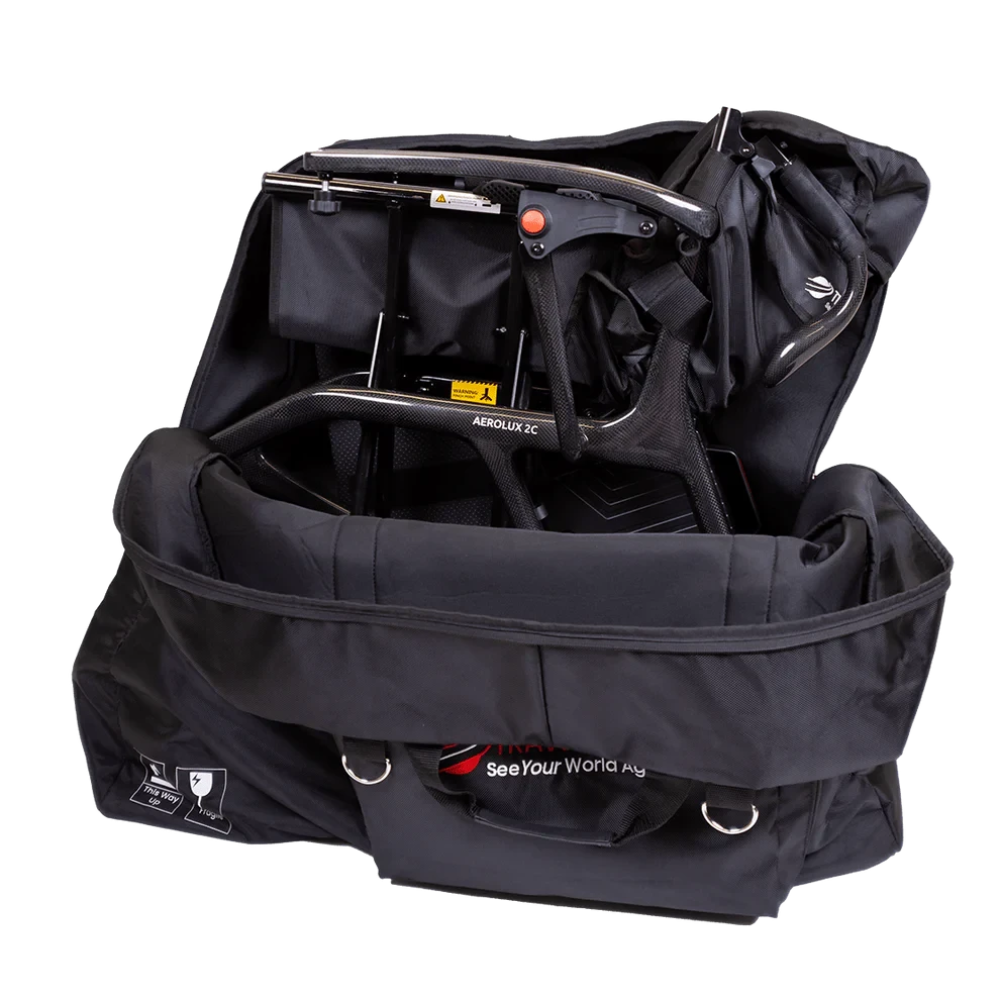 Travel Buggy AEROLUX 2C carbon fiber power wheelchair folded securely inside the custom fitted travel bag.